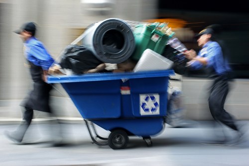 Workers sorting commercial recyclables at a transfer station